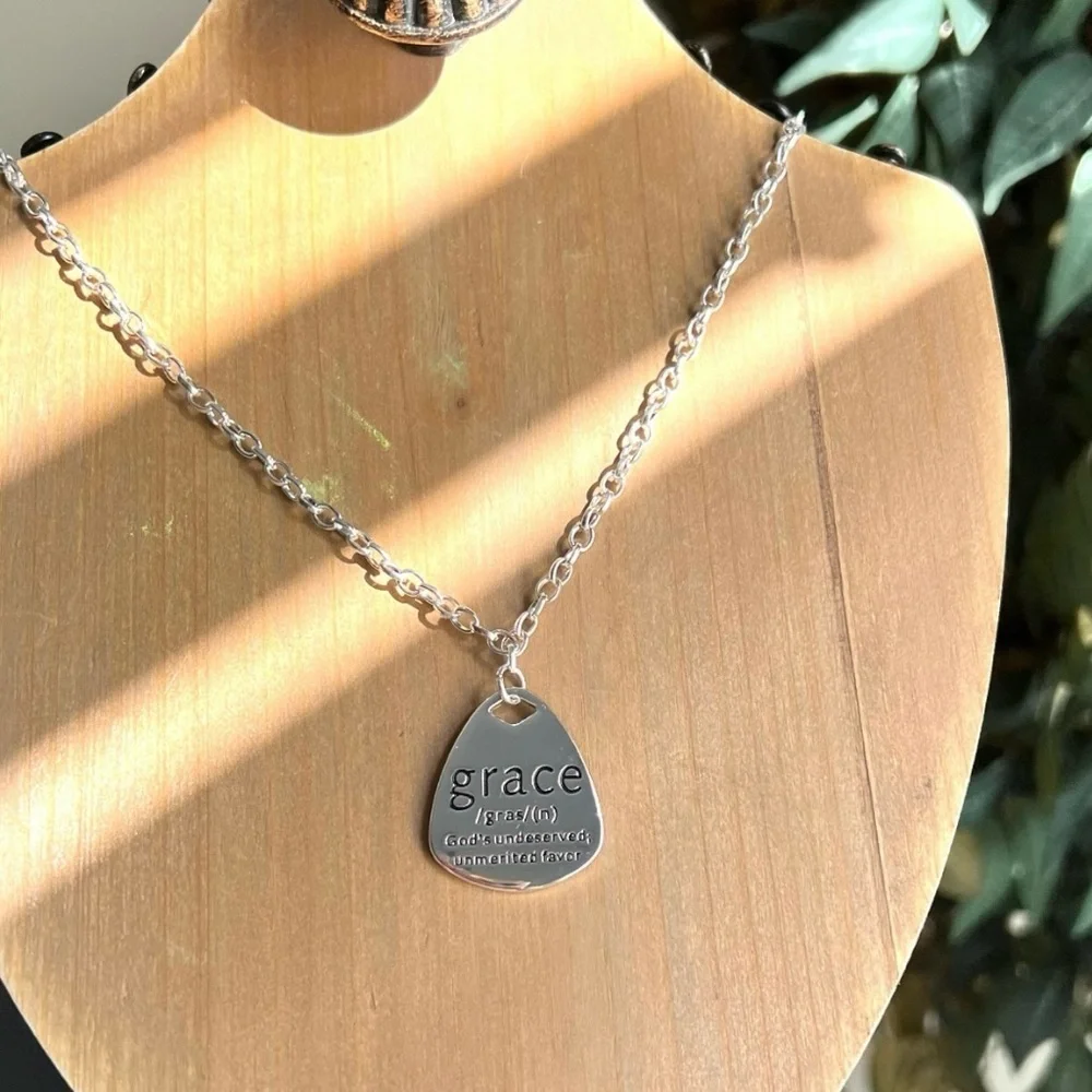 Grace Pendant Necklace in Silver toned and stainless steel. 18” long